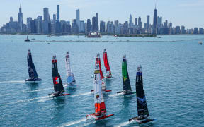 The SailGP fleet sail towards the Chicago skyline, 2022.
