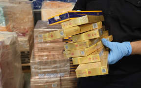 A Customs investigation has led to five arrests in Auckland and the seizure of over 1.36 million illicit cigarettes, two firearms, and a substantial amount of cash as part of Operation Montreal.