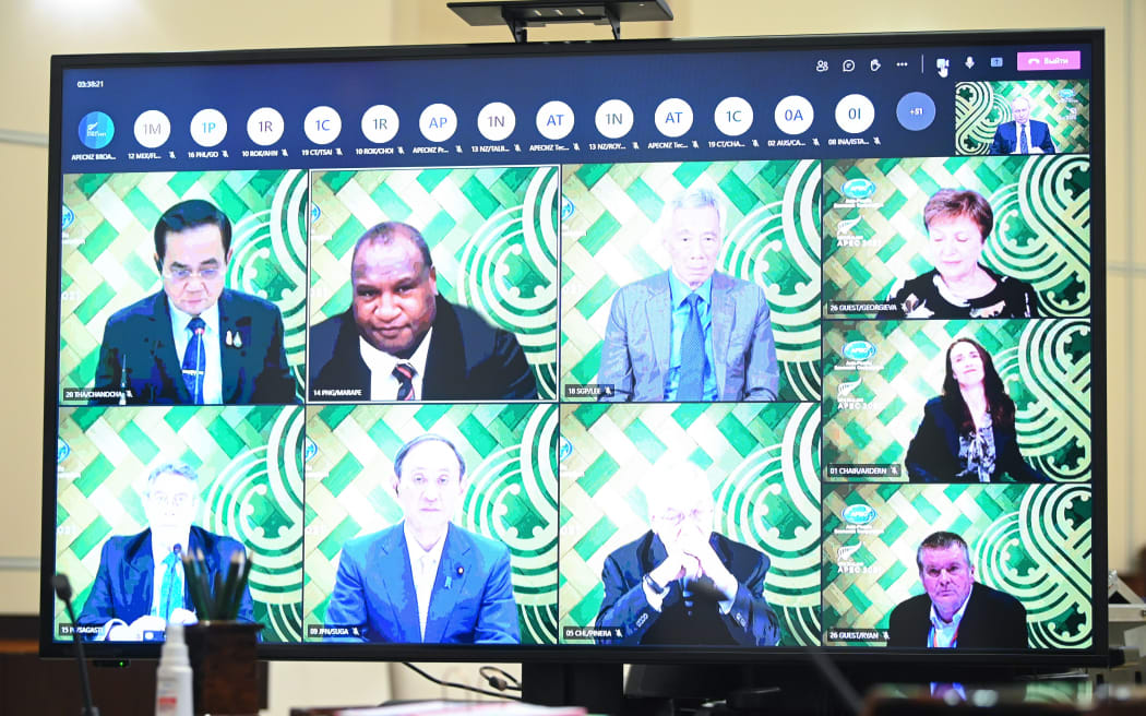 A screen shows attendees of an informal meeting of APEC Economic Leaders (the Asia-Pacific Economic Cooperation forum) via videoconference.