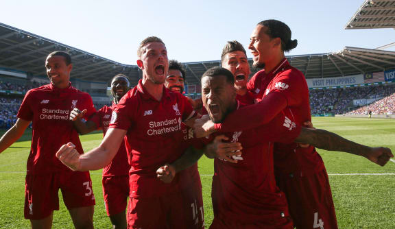 21st April 2019 - Premier League - Cardiff City v Liverpool - Georginio Wijnaldum of Liverpool celebrates scoring their 1st goal with team mates - Photo: Marc Atkins/Offside / www.photosport.nz