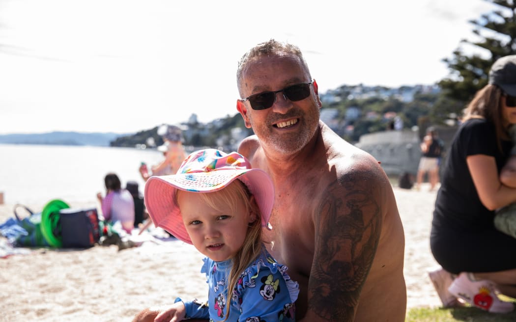 Daryll and his granddaughter enjoying the weather at Oriental Parade