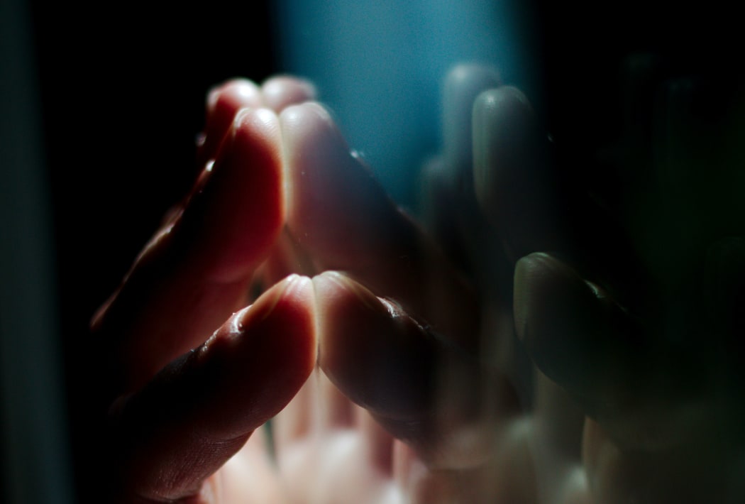 close up of hand on glass