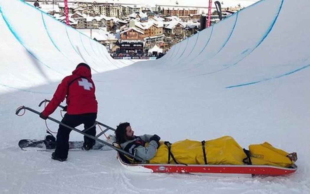 Beau James Wells is carted away by medical staff in Colorado.