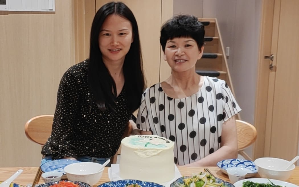 Sophie Liu and her mother celebrating the mother's birthday in China two years ago.