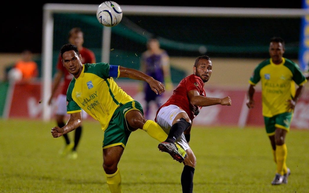 Alvin Tehau of Tefana tussles with Rewa's Tevita Waranaivalu to win an aerial ball.