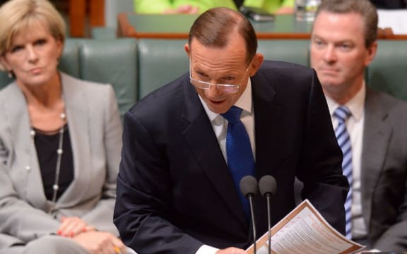 Tony Abbott, centre, and Julie Bishop at Parliament today.