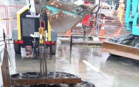 The access hole used to repair the crack in the pipe found by contractors.