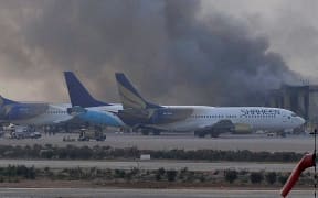 Smoke rises after militants launched an early morning assault at Jinnah International Airport.