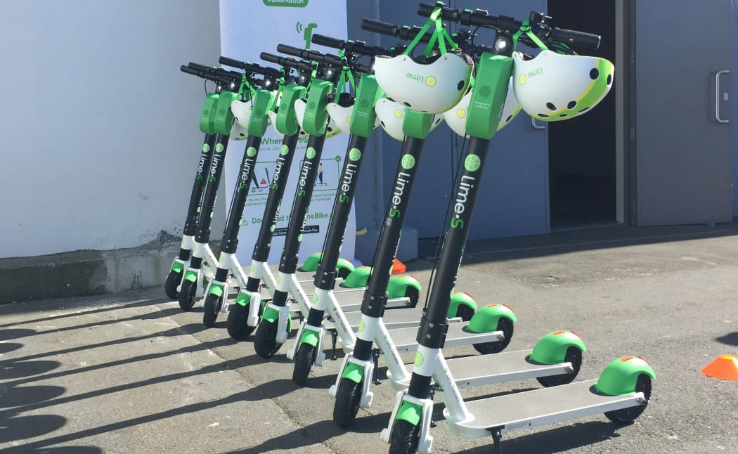 Rack 'em up: Lime scooters for hire outside the TraffiNZ conference in wellington this week - as part of a charm offensive in the capital.