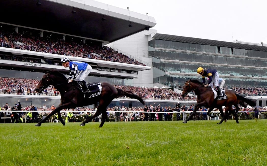 Gold Trip, ridden by Mark Zahra (L), crosses the line to win the Aus$8 million (6 million USD) Melbourne Cup horse race in Melbourne on November 1, 2022.