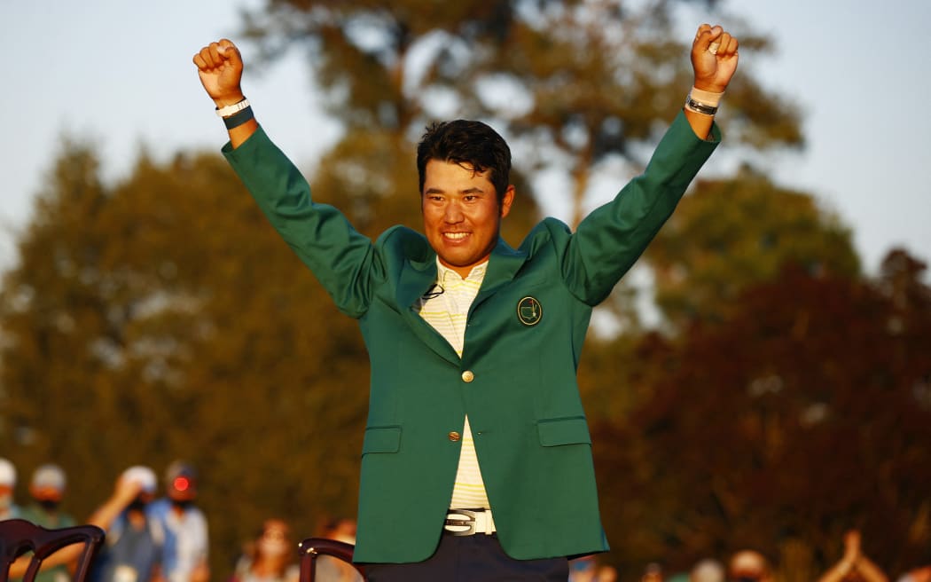 AUGUSTA, GEORGIA - APRIL 11: Hideki Matsuyama of Japan celebrates during the Green Jacket Ceremony after winning the Masters at Augusta National Golf Club on April 11, 2021 in Augusta, Georgia.