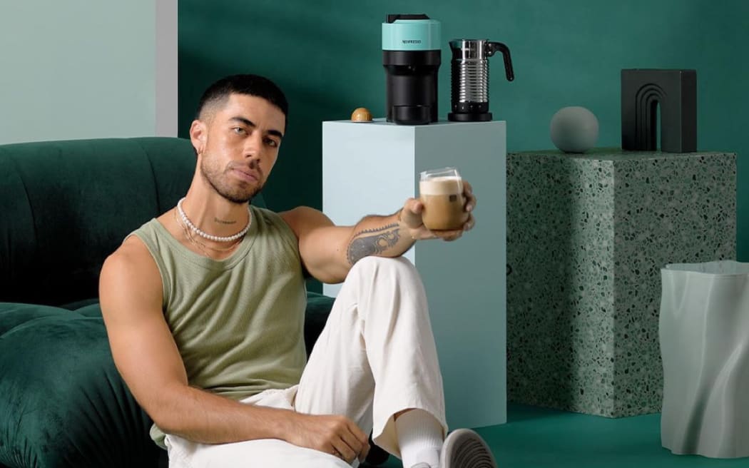 Singer Teeks poses in a promotional image for Nespresso