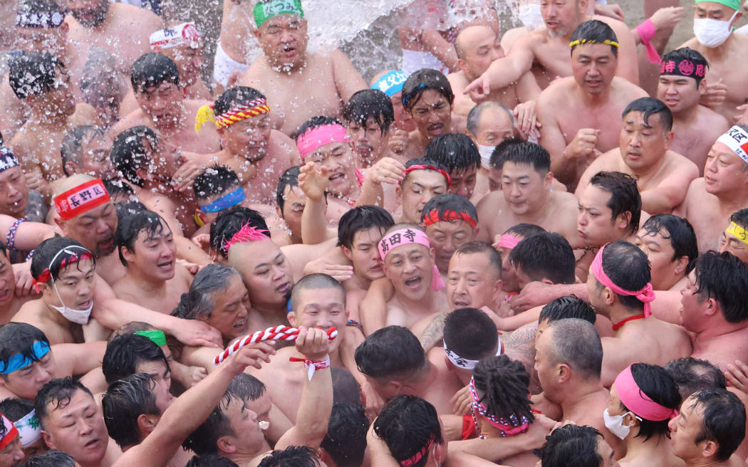 The battalions of men in fundoshi, light cotton loincloth, compete to touch the "Lucky Man" during the Hadaka Matsuri, Naked Festival at Konomiya Shrine in Inazawa city, Aichi Prefecture on Feb. 3rd, 2023. The 1,200-year history ritual took place in three years due to the COVID pandemic.  ( The Yomiuri Shimbun ) (Photo by Hisao Aoki / Yomiuri / The Yomiuri Shimbun via AFP)