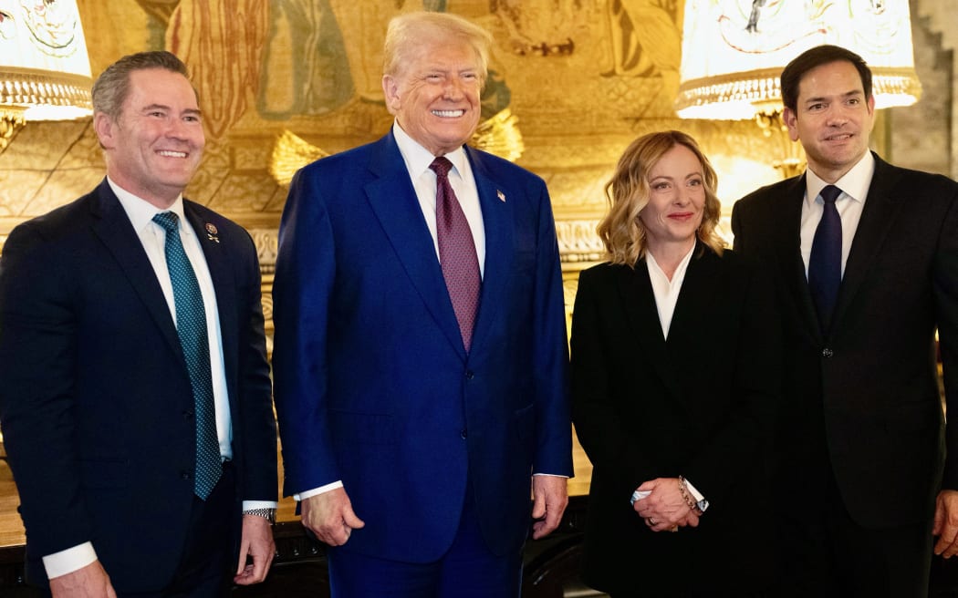 This handout picture released by the Palazzo Chigi press office on January 5, 2025 shows Italy's Prime Minister Giorgia Meloni (2ndR) and US President-elect Donald Trump (2ndL) posing with Senator Marco Rubio (R) and US incoming national security advisor Mike Waltz (L) at Trump's Mar-A-Lago Club on January 4, 2025 in Palm Beach, Florida. (Photo by Filippo ATTILI / Palazzo Chigi press office / AFP) / RESTRICTED TO EDITORIAL USE - MANDATORY CREDIT "AFP PHOTO /PALAZZO CHIGI PRESS OFFICE" - NO MARKETING NO ADVERTISING CAMPAIGNS - DISTRIBUTED AS A SERVICE TO CLIENTS