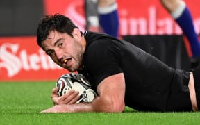 All Blacks player Luke Jacobson scores a try during the Rugby Championship.