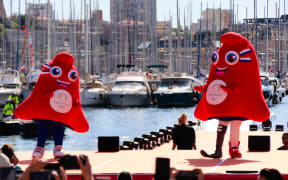 France, Marseille, 2024-05-08. The Phryges, official mascots of the Paris 2024 Games, were present at the ceremony to welcome the Olympic flame to the Old Port, ahead of the Paris 2024 Olympic and Paralympic Games. Photograph by Julie GAZZOTI / Hans Lucas.
France, Marseille, 2024-05-08. Les Phryges, mascottes officielles des Jeux de Paris 2024, etaient presentes lors de la ceremonie d arrivee de la flamme Olympique sur le Vieux-Port, avant les Jeux Olympiques et Paralympiques de Paris 2024. Photographie par Julie GAZZOTI / Hans Lucas. (Photo by Julie Gazzoti / Hans Lucas / Hans Lucas via AFP)