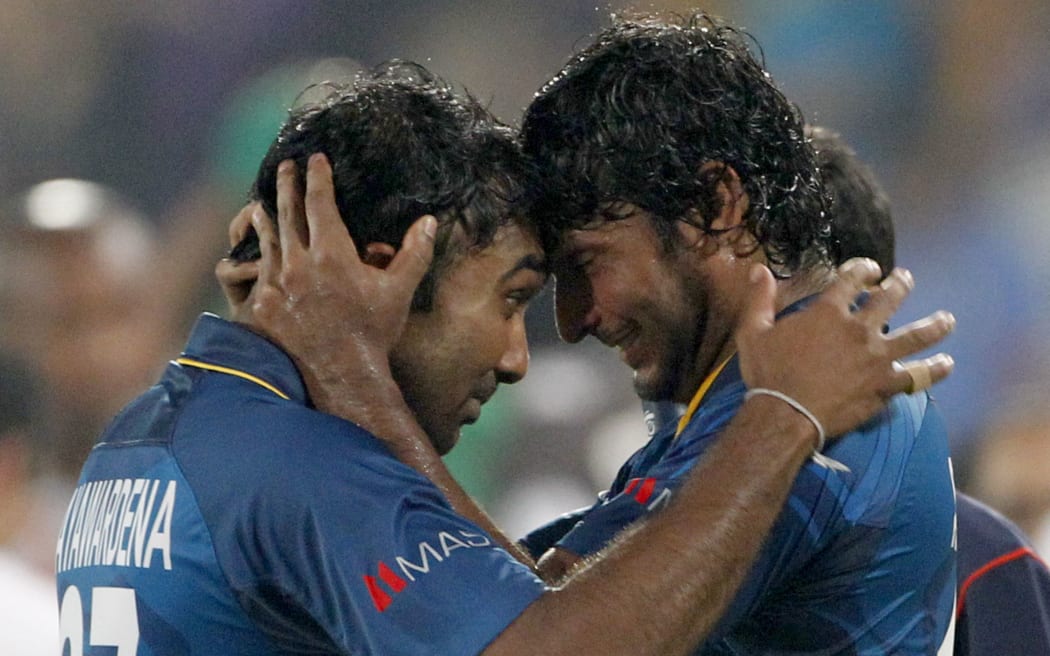 Mahela Jayawardene and Kumar Sangakkara celebrate.