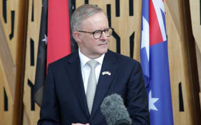 Australian Prime Minister Anthony Albanese speaks at a joint press conference with his Papua New Guinea counterpart in Port Moresby on January 12, 2023. - Albanese called for a "swift" new security deal with Papua New Guinea, as his government seeks to parry China's expanding influence in the Pacific. (Photo by ANDREW KUTAN / AFP)