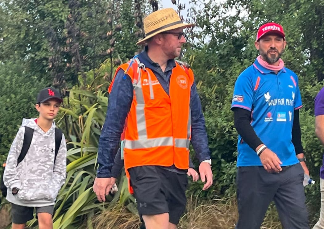 Temel Atacocugu, right, on his Walk for Peace on outskirts of Christchurch