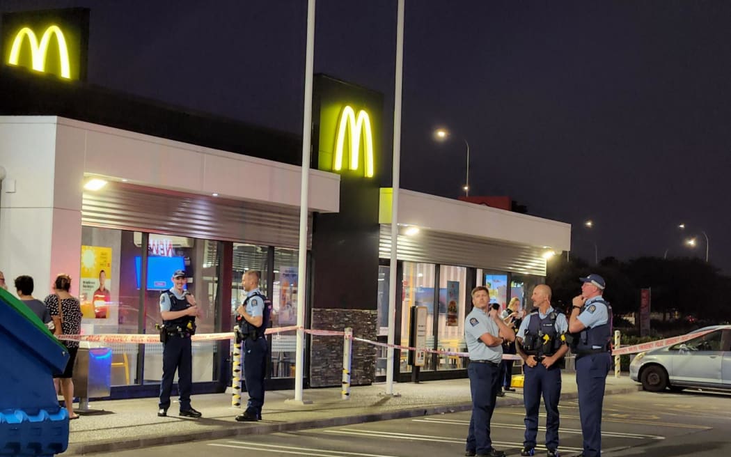 Police at the scene of an assault at McDonald's on Stoddard Road in Auckland's Mount Roskill on 11 January 2024.