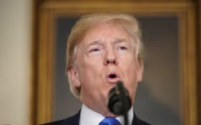 US President Donald Trump speaks before signing trade sanctions against China on March 22, 2018, in the Diplomatic Reception Room of the White House in Washington, DC, on March 22, 2018.