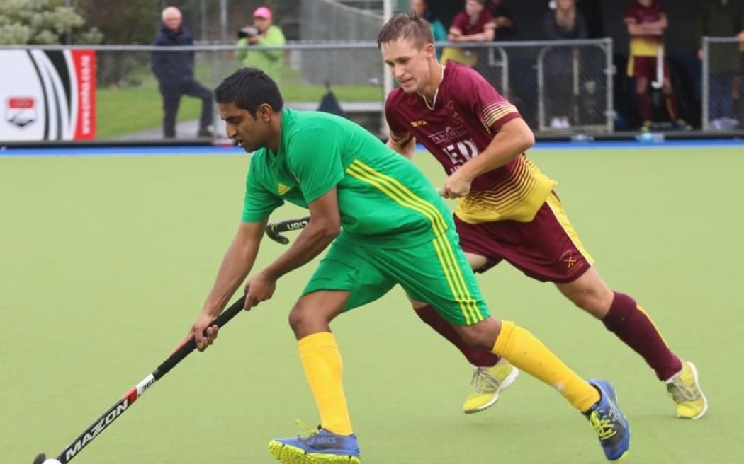 Hitesh Dahya controls the ball during a match.