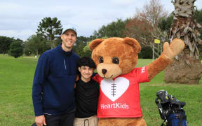 Heart Kids NZ's ambassadors Tom Abercrombie and Leighton Leevard with Maia.