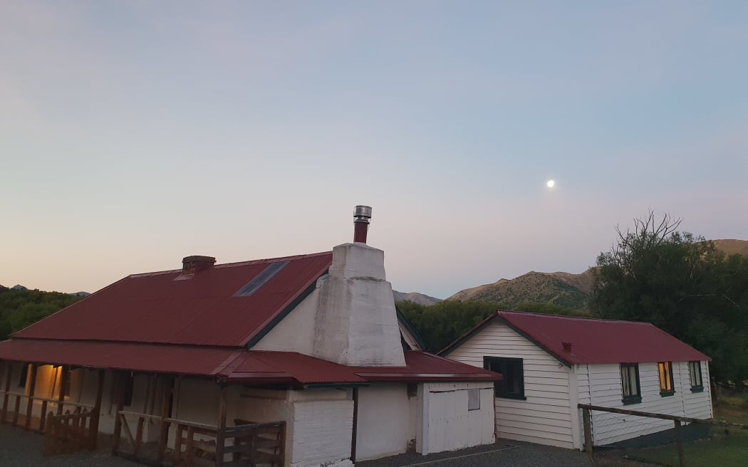 Dawn breaks over an old cob building at Tarndale, Molesworth Station