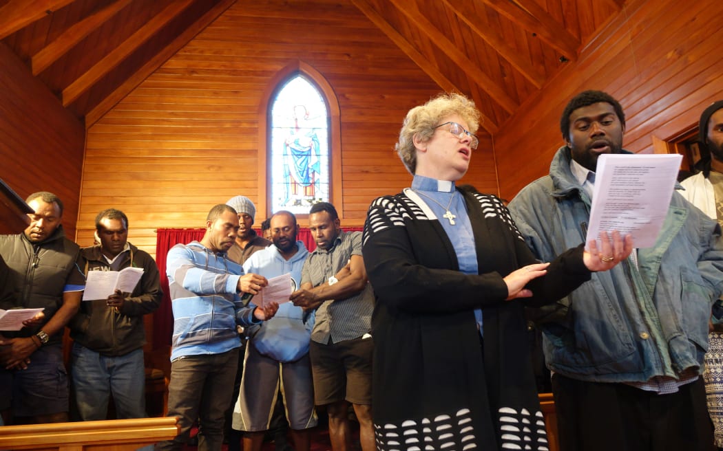 Anglican Vicar Dawn Daunauda leads the quake remembrance service at Ward's St Peters Chapel.