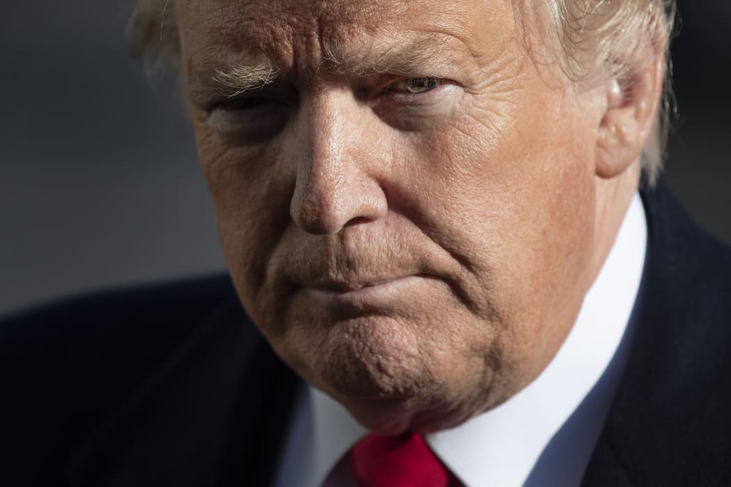 US President Donald Trump speaks as he arrives at the White House in Washington, DC, on January 6, 2019, after meetings at Camp David.
