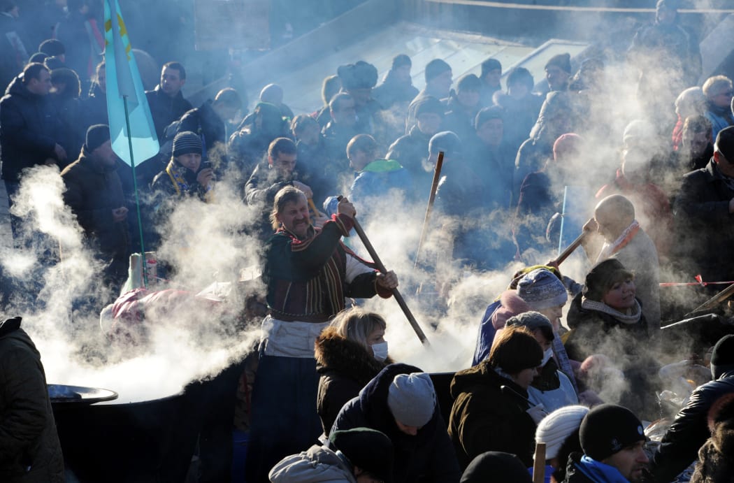 Pro-EU protesters camping in Independence Square are demanding the president's resignation.