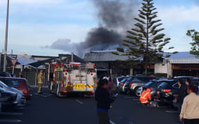 The smoke from a fire at New Lynn Mall.
