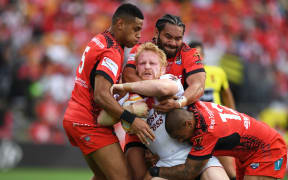 England's James Graham wrapped up by Tonga