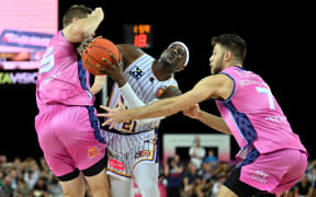Kouat Noi of the Sydney Kings up against Breakers defenders in 2023 NBL Finals series.