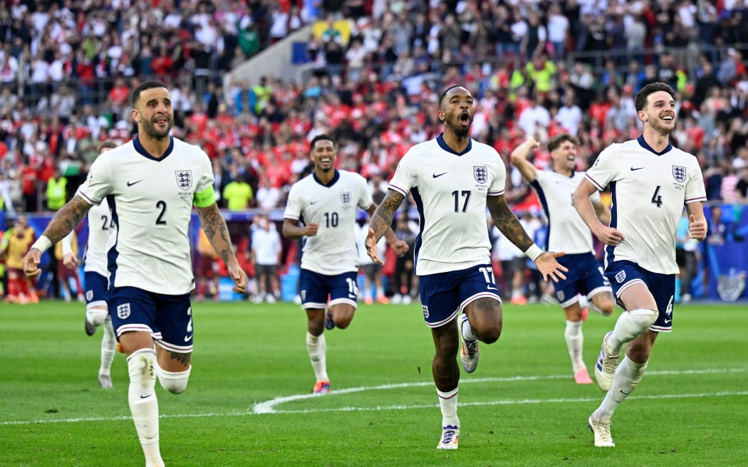 England's defender #02 Kyle Walker, England's midfielder #10 Jude Bellingham, England's forward #17 Ivan Toney and England's midfielder #04 Declan Rice celebrate after winning the UEFA Euro 2024 quarter-final football match between England and Switzerland.