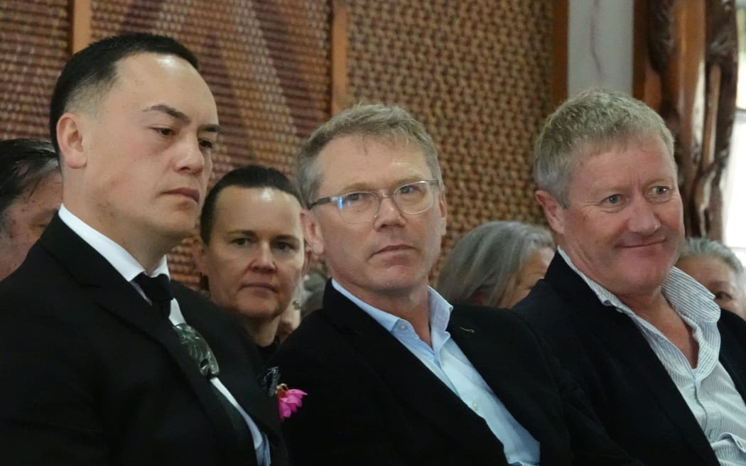 From left, kaikōrero Isaiah Apiata, Treaty Negotiations Minister Paul Goldsmith and Northland MP Grant McCallum listen to the speeches of welcome.