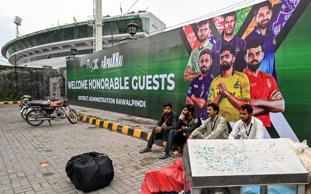 Vendors pack their belongings as they leave Rawalpindi Cricket Stadium following the postponement of the Pakistan Super League (PSL) match after the alleged shooting of a drone outside the stadium in Rawalpindi on May 8, 2025.