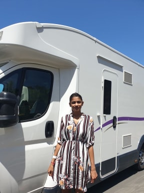 Sylvia Nandani outside her caravan at Whangaparaoa.