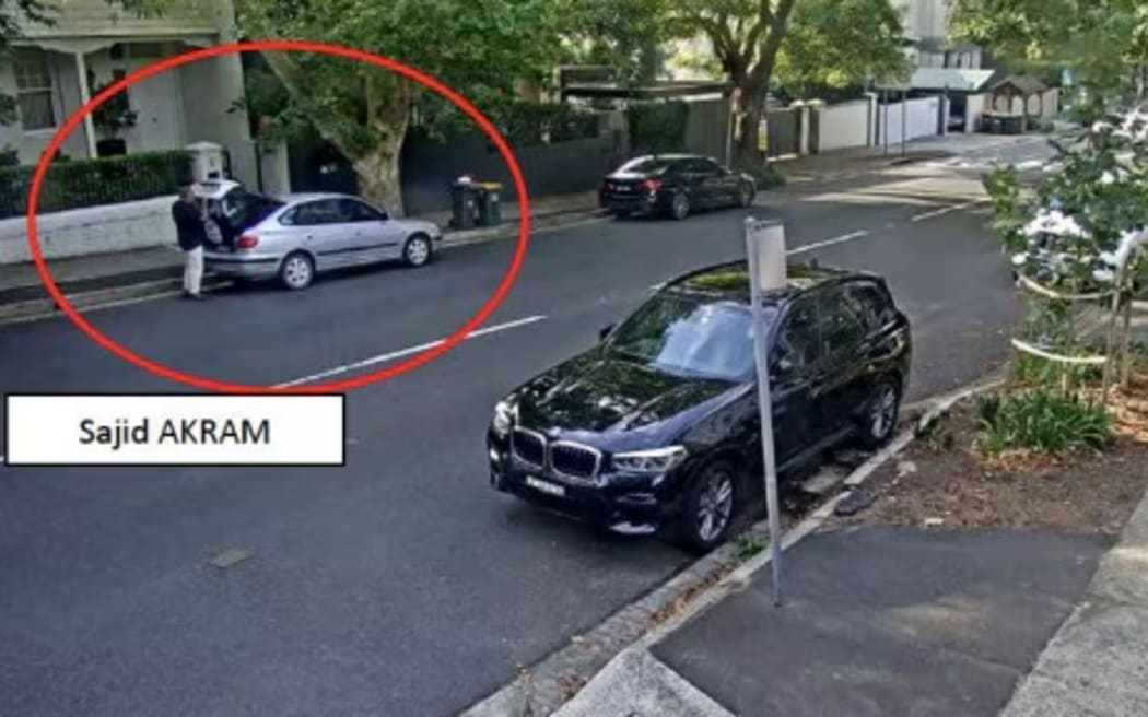Sajid Akram is seen outside the car on Ocean Road in Woollahra.