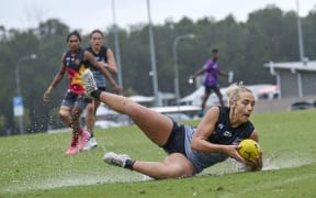 Demi Salton of the NZ Kahu competes for the ball.