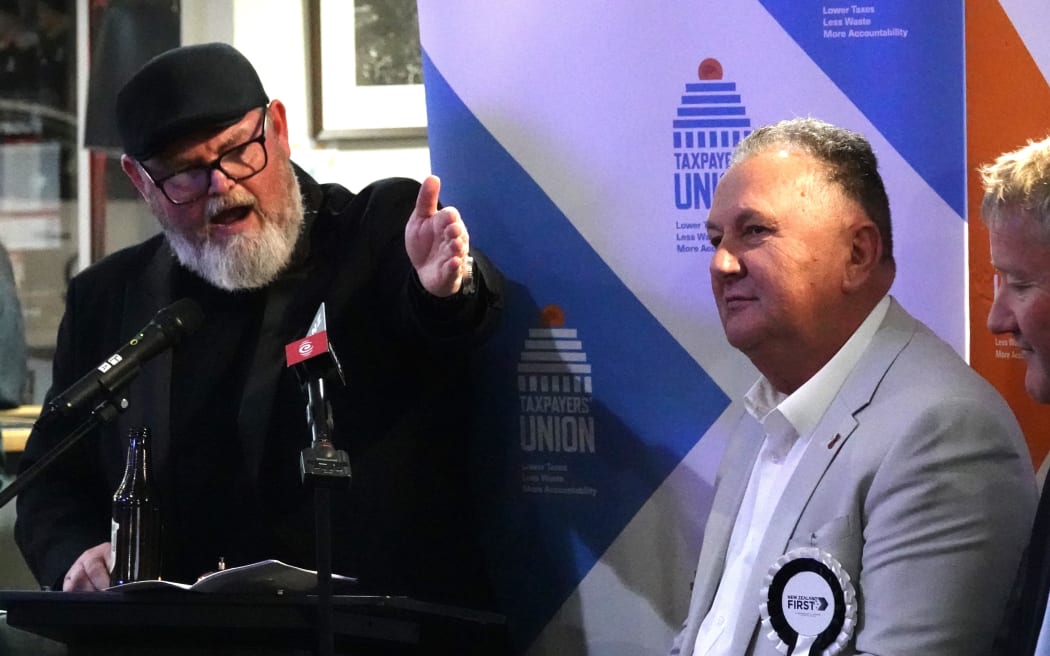 MC Martyn "Bomber" Bradbury opens the Taxpayers' Union Northland election debate at Kerikeri's Homestead Tavern as New Zealand First's Shane Jones awaits his turn to speak.