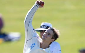 Kane Williamson bowling in 2013 with an action deemed suspect.