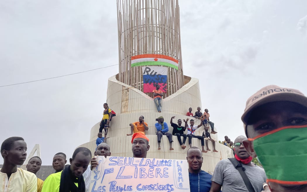 Supporters of the Nigerien defence and security forces gather during a demonstration outside the national assembly in Niamey on July 27, 2023.