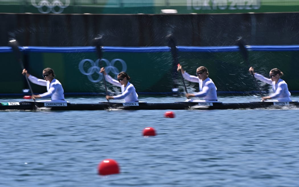 (From L) New Zealand's Lisa Carrington, Alicia Hoskin, Caitlin Regal and  Teneale Hatton compete in a heat of the women's kayak four 500m event during the Tokyo 2020 Olympic Games.