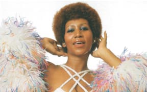 Booklet image from 'Aretha Franklin: A Portrait of the Queen 1970-1974'. Aretha poses with feather boa.