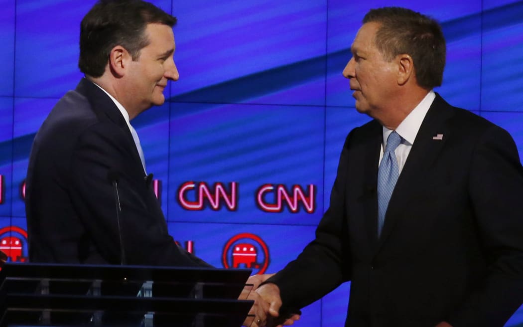 Texas Senator Ted Cruz, left, and Ohio Governor John Kasich shake hands following a CNN debate on 10 March in Miami.