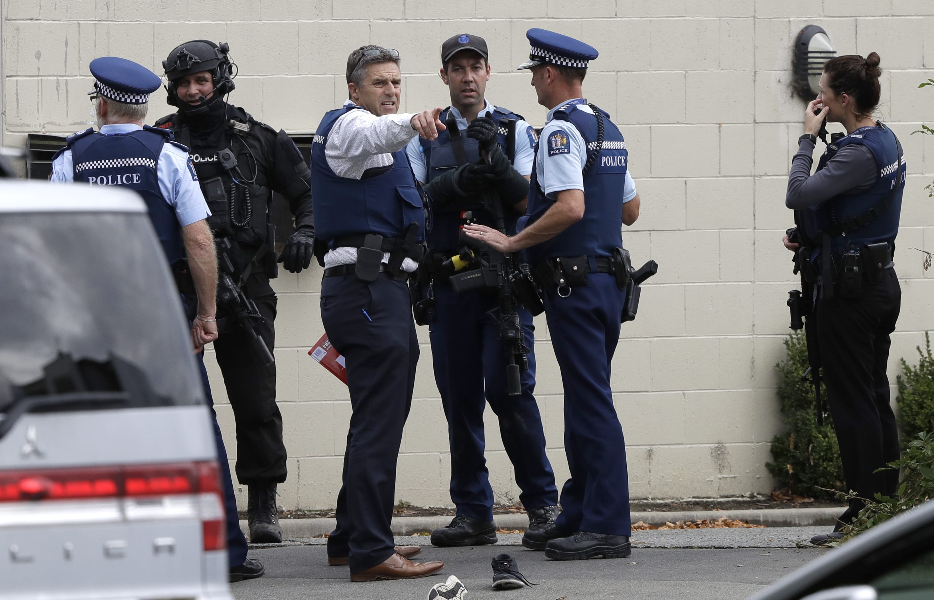 Police stand outside a mosque in central Christchurch, New Zealand, Friday, March 15, 2019.