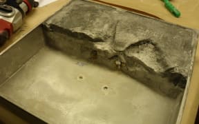 The methamphetamine was mixed with gypsum and disguised as concrete umbrella stands. It was detected after extensive testing.
