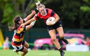 Liv McGoverne of Canterbury fends off Emma-Lee Heta of Waikato during the Farah Palmer Cup Final at Rugby Park, Christchurch, New Zealand, 31st October 2020.