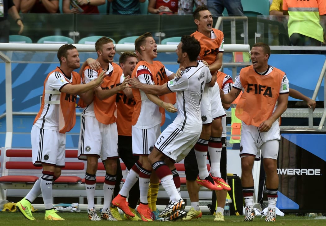 German players celebrate Mats Hummels goal during the Group G football match against Portugal at the Fonte Nova Arena in Salvador, Brazil.